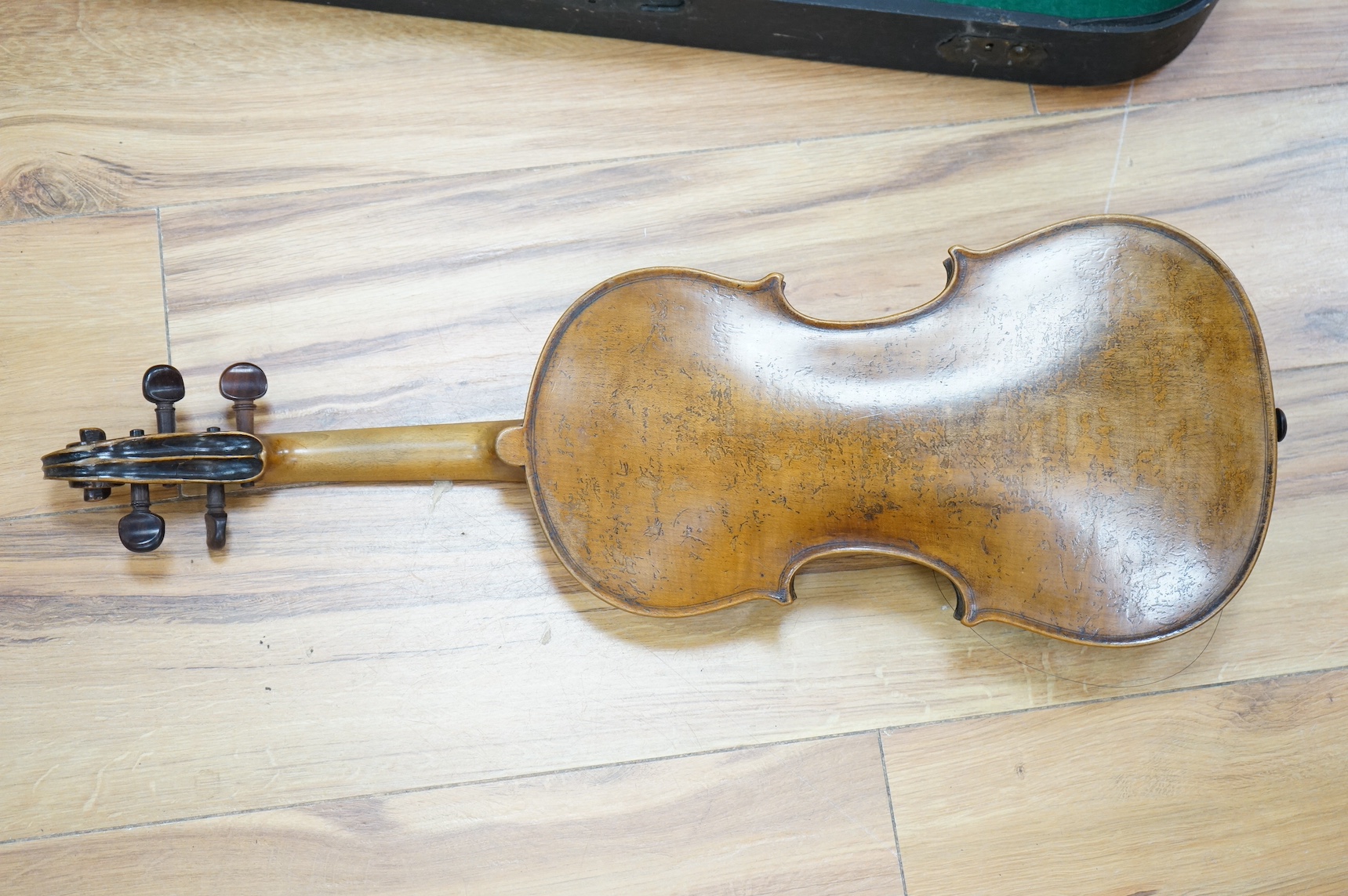 A cased 19th century French violin, back, 36cm. Condition - fair